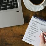 Female checking off items on Compliance checklist in the workplace